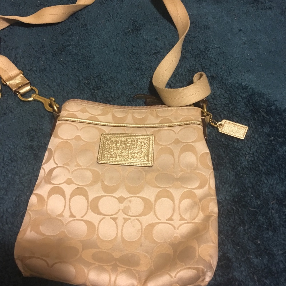 Gold and cream coach purse